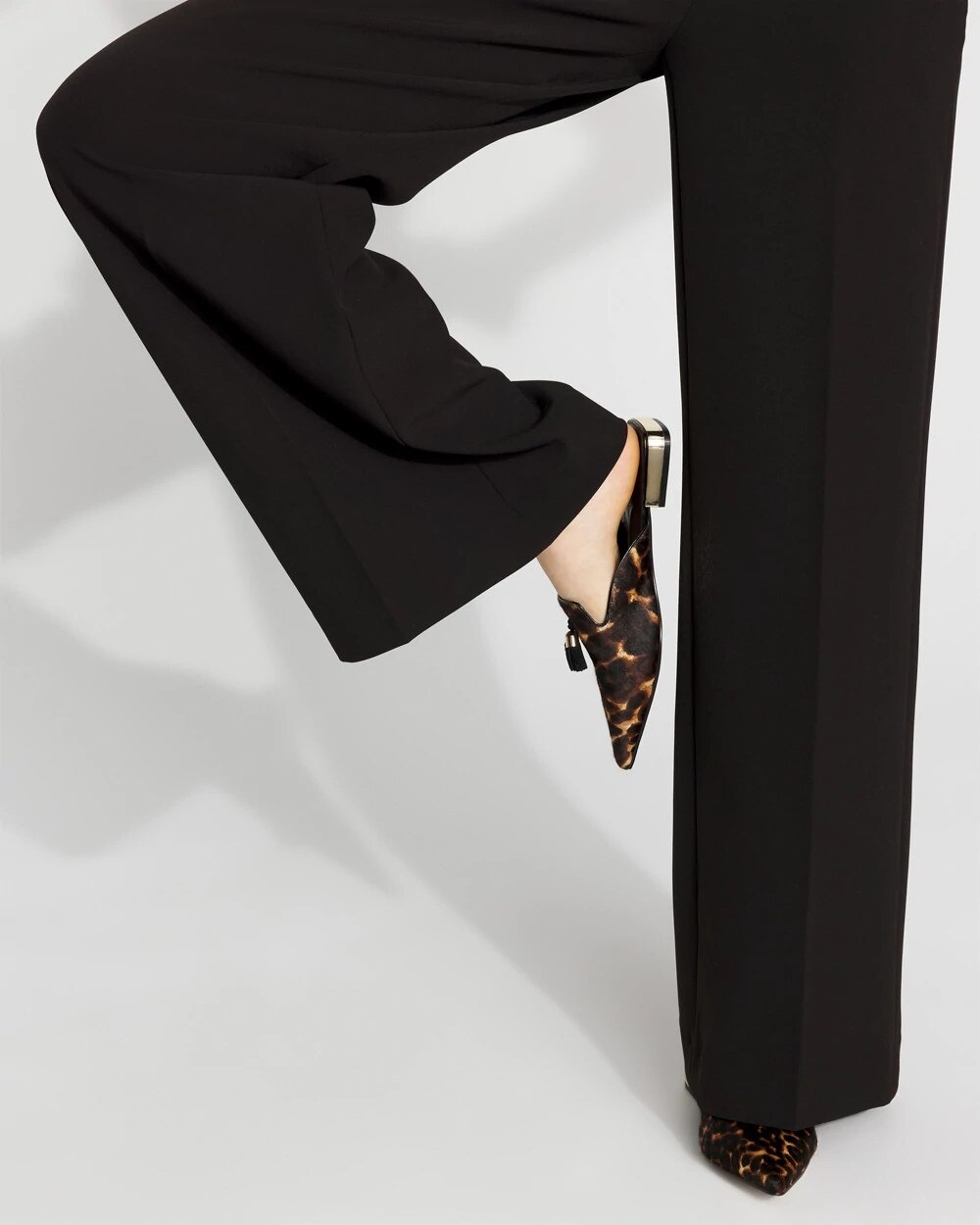 WHBM_Leopard20Tassel20Mule_570397356_BLK000920_OF_MAIN-1.jpeg