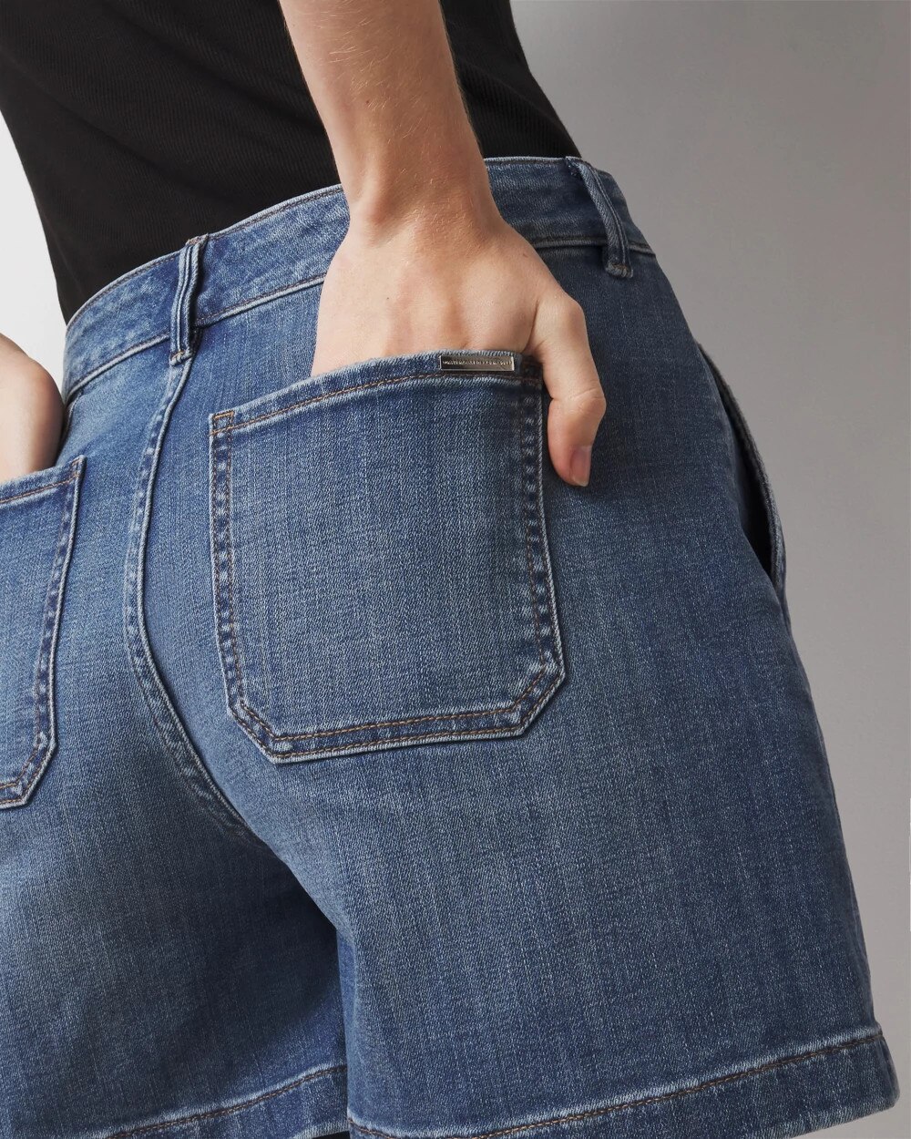 WHBM_Pleated20Denim20Short_570382144_BLU004001_OF_ALT202.jpeg